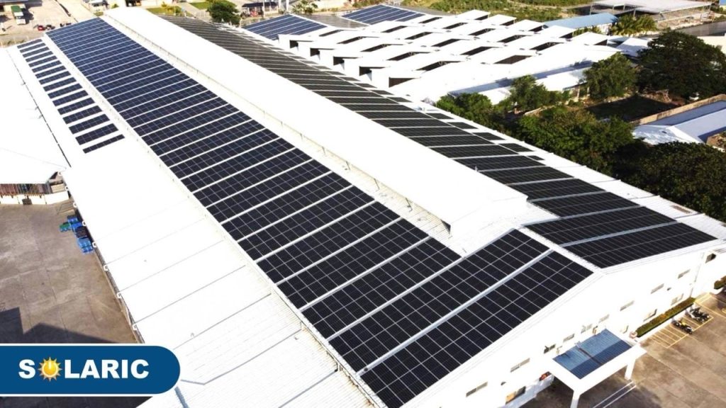 Future-Proof Your Filipino Home: The Ultimate Guide to Affordable Solar Power 6 A bird s eye view of a sprawling solar farm atop a factory complex showcasing the industry s embrace of sustainable energy