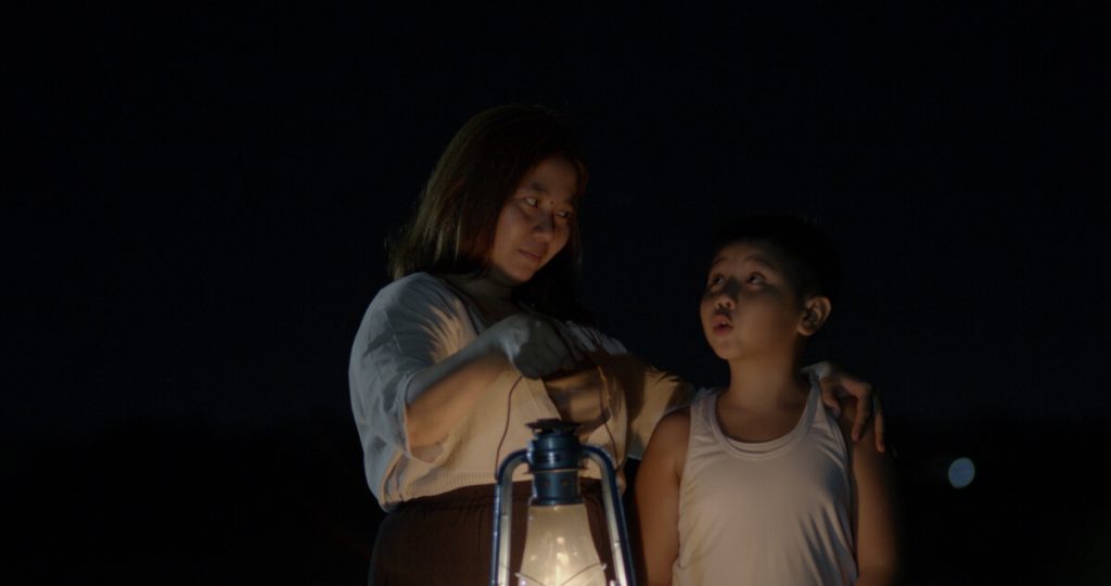 Production manager Kristin Joy Bactad Jor in a cameo role with child actor Jayden Zachary Sanchez in Bakit Ako Sinusundan ng Buwan