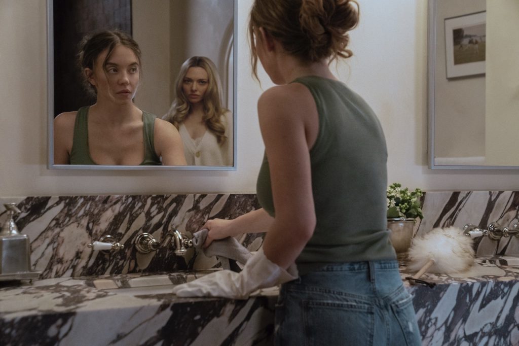 NEW MOVIES THIS WEEK: Anaconda, The Housemaid, and More! 3 Sydney Sweeney as Millie and Amanda Seyfried as Nina in The Housemaid
