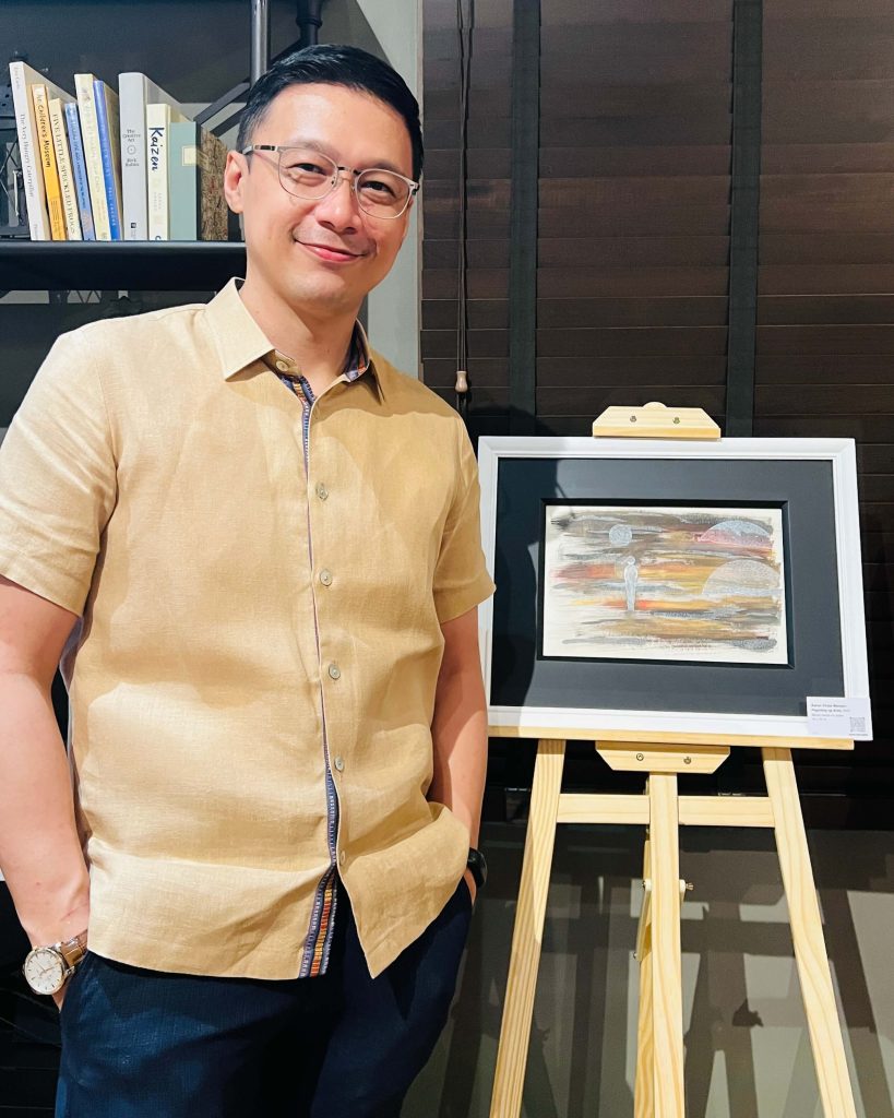 The Art of We: How Aaron Virata Mempin is Building Bridges Through Shared Creativity 22 Filipino Geometric Abstractionist Aaron Virata Mempin with one of his solo works, “Paglubog ng Araw”.