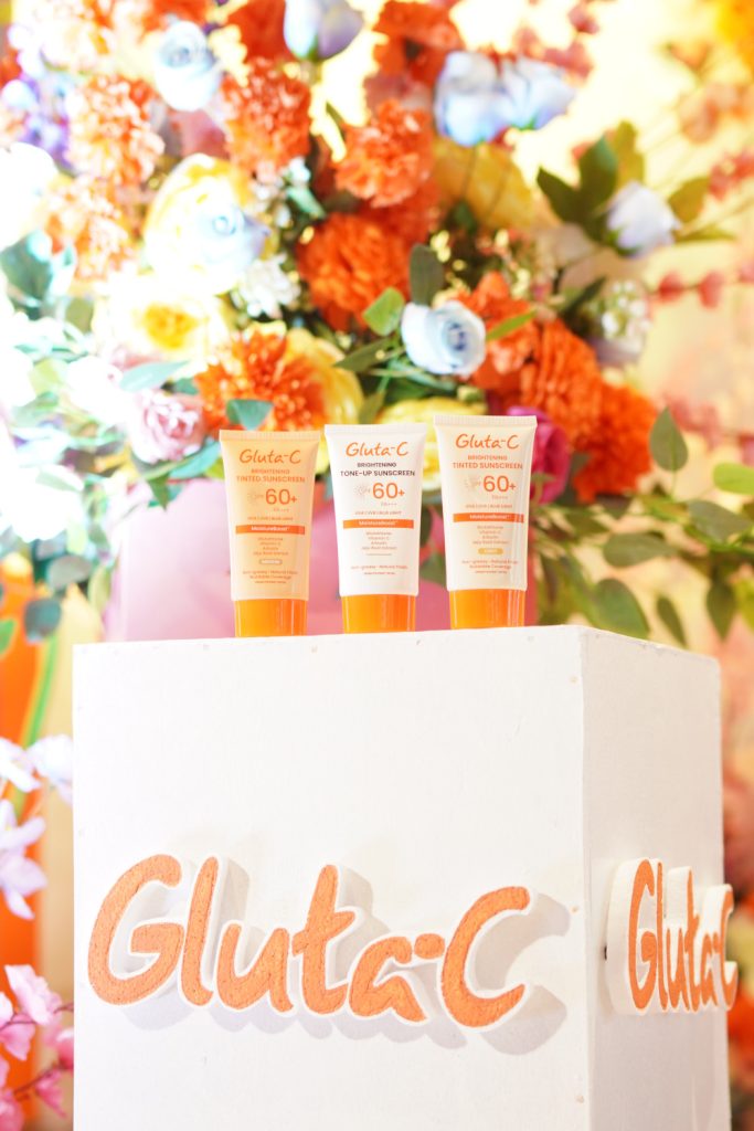 gluta c spf60 sunscreen product with flowers