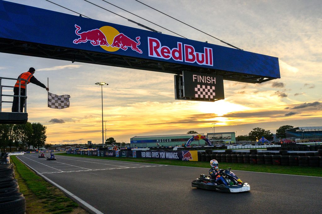 Max Verstappen passes 100 karts in just 14 laps in Red Bull's Max vs 100 8 Max vs 100 Race Photo with Red Bull Banner 01.jpg